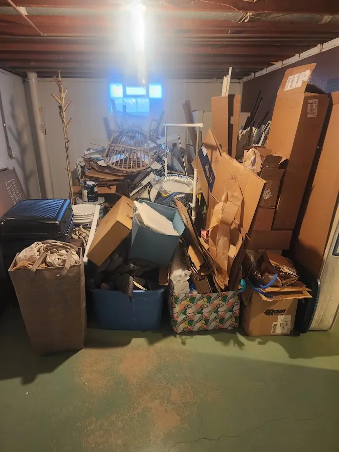 Roll-off dumpster container at job site for 15 Yard Dumpster Rental in Forest Hills